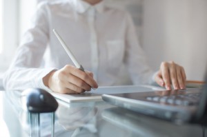 Female designer using graphics pad in office